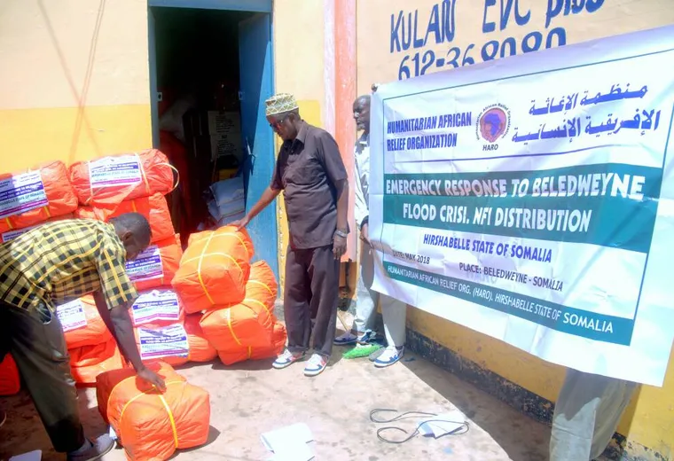 HARO staff stack relief bundles during the Beledweyne flood response, May 2018