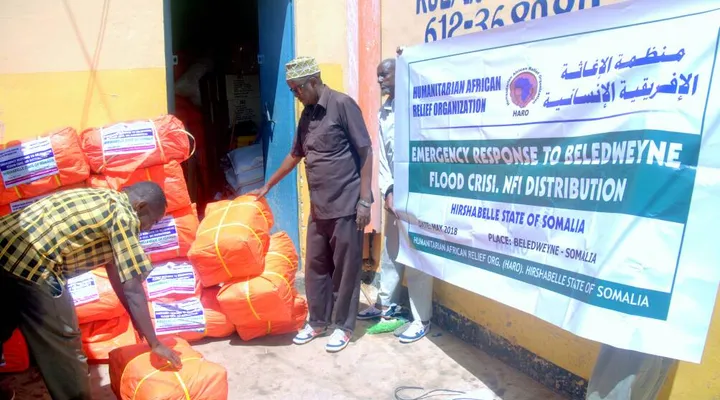 HARO staff stack relief bundles during the Beledweyne flood response, 2018