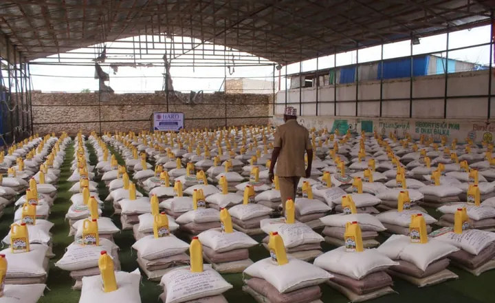Sacks of rice and jugs of cooking oil stacked in a HARO warehouse, ready for emergency distribution