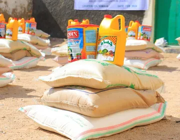 Inside a HARO food package: sacks of rice and flour with jugs of cooking oil