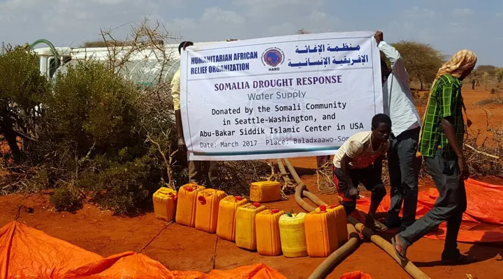 A HARO team fills tarpaulin water ponds from a tanker truck outside Balad Hawo, Gedo, 2017