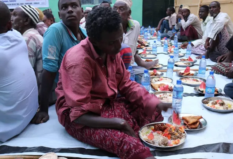 Plates of rice, meat and fruit laid out for iftar in Garowe, 2019